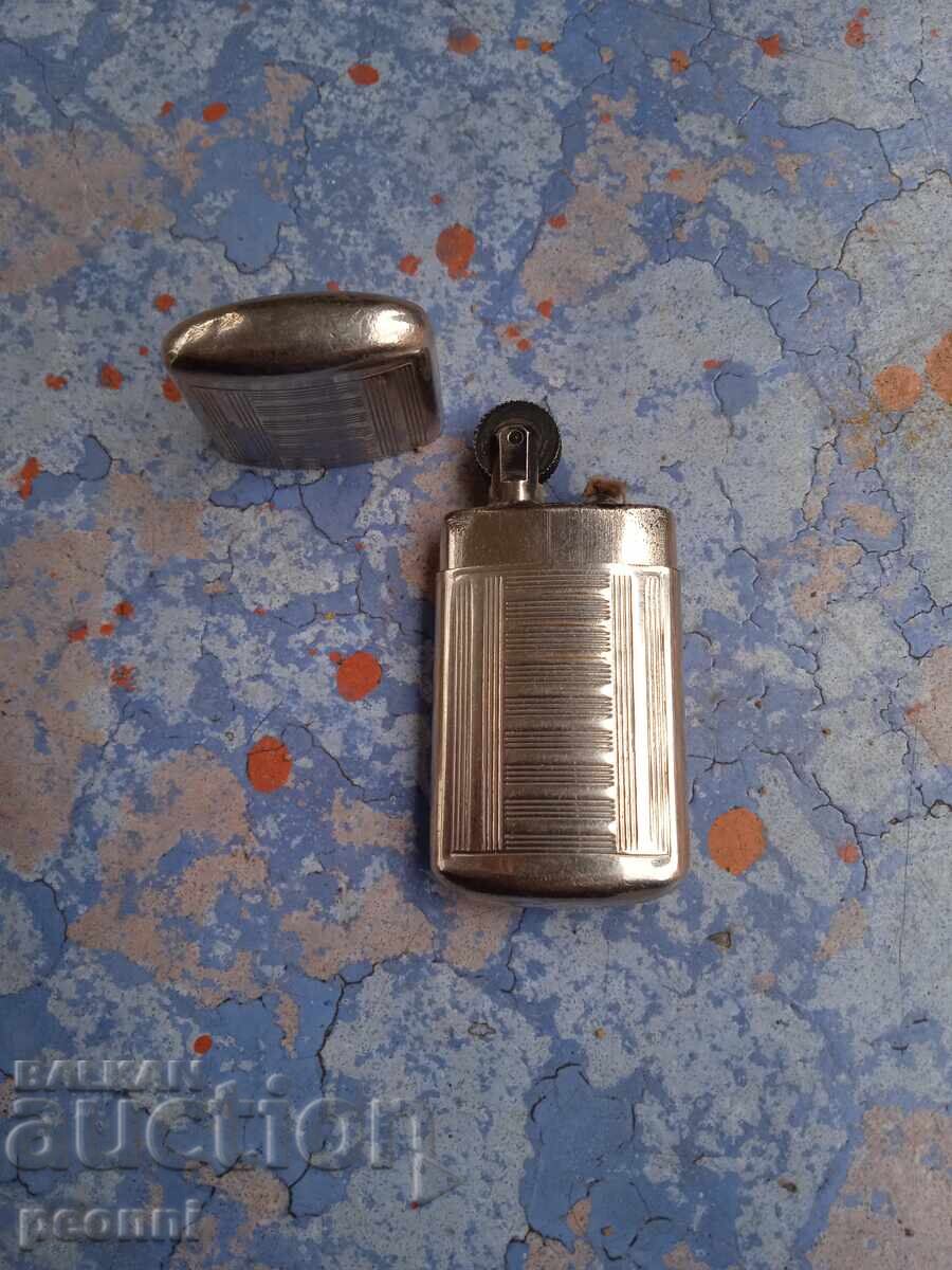 Auction Old petrol lighter Auction Old petrol lighter