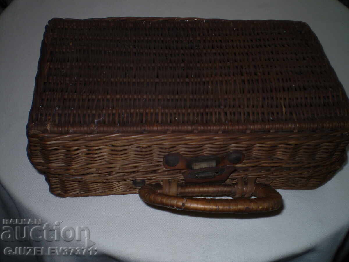 Old small decorative suitcase Retro wicker picnic basket Old small decorative suitcase Retro wicker picnic basket