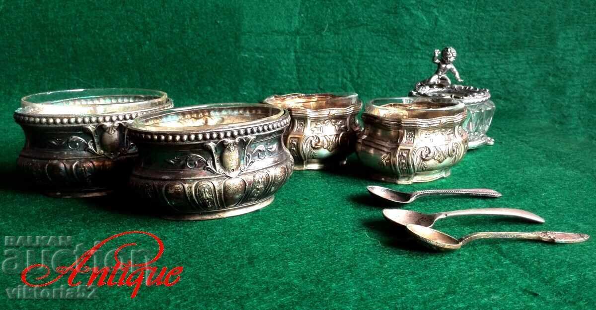 Vintage silver-plated dishes and a salt, pepper and caviar spoon with a Vintage silver-plated dishes and a salt, pepper and caviar spoon with a