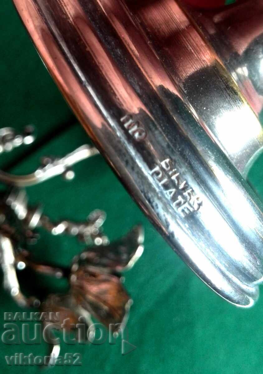 Delivery of Miniature old silver-plated candlesticks with a cherub-angel Delivery of Miniature old silver-plated candlesticks with a cherub-angel