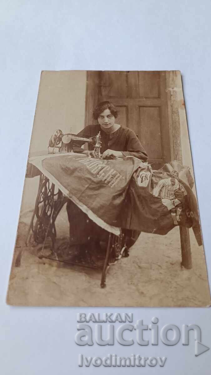 Photo Young girl sewing the flag of SK Rakovski village of Maslovo 1932