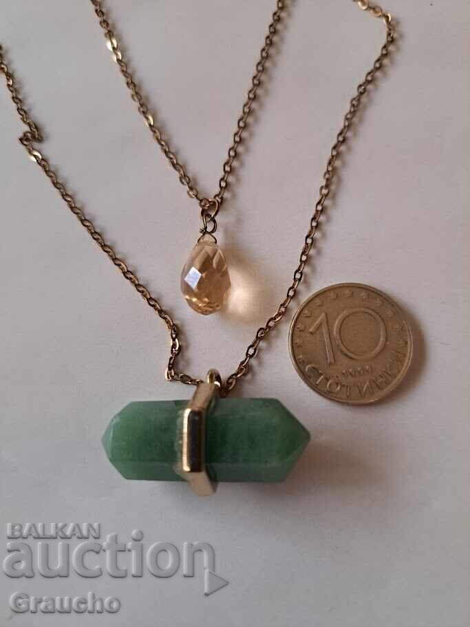 Auction Two pendants with semi-precious stones Auction Two pendants with semi-precious stones