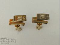 Old cufflinks, anklets with the letter V.