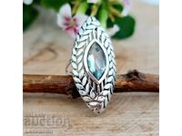 Silver ring with blue Topaz