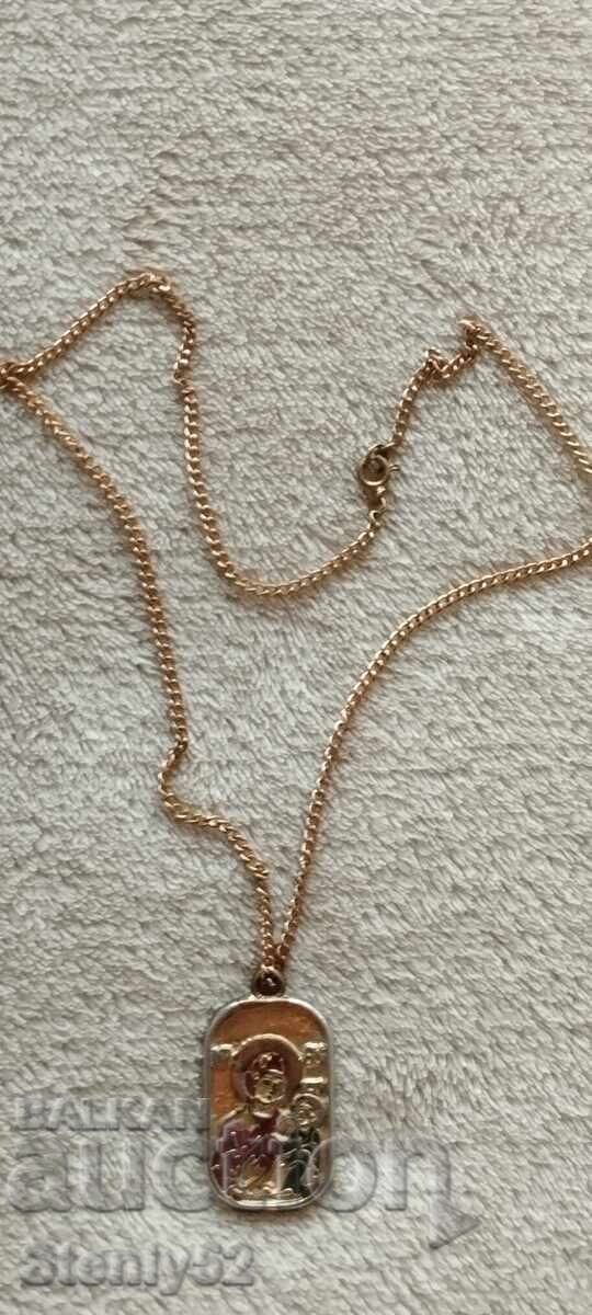 Auction Medallion with a cross and the Virgin Mary with the baby. Auction Medallion with a cross and the Virgin Mary with the baby.