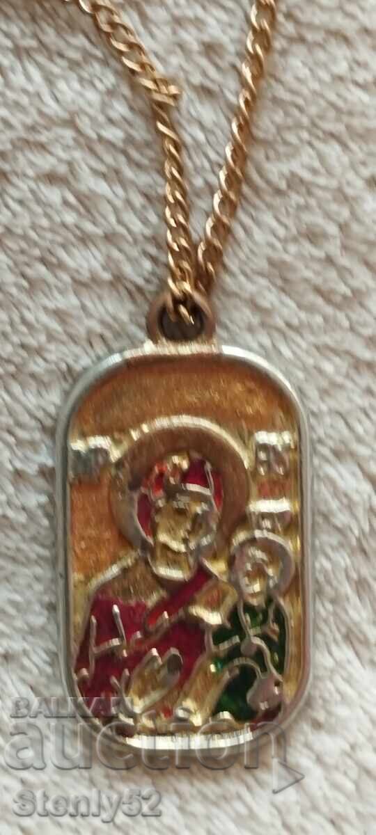 Delivery of Medallion with a cross and the Virgin Mary with the baby. Delivery of Medallion with a cross and the Virgin Mary with the baby.