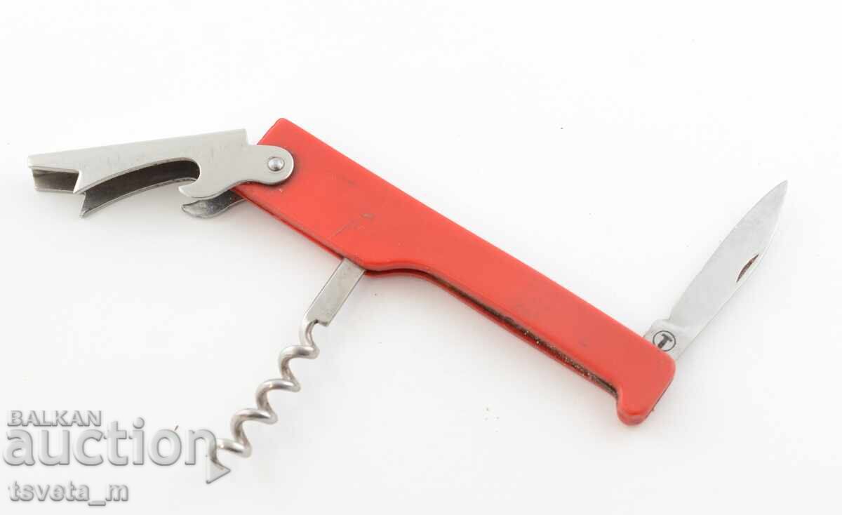 Auction  Corkscrew and blade opener