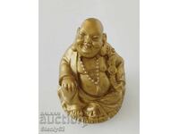 Plaster figure of the Buddha of Wealth.