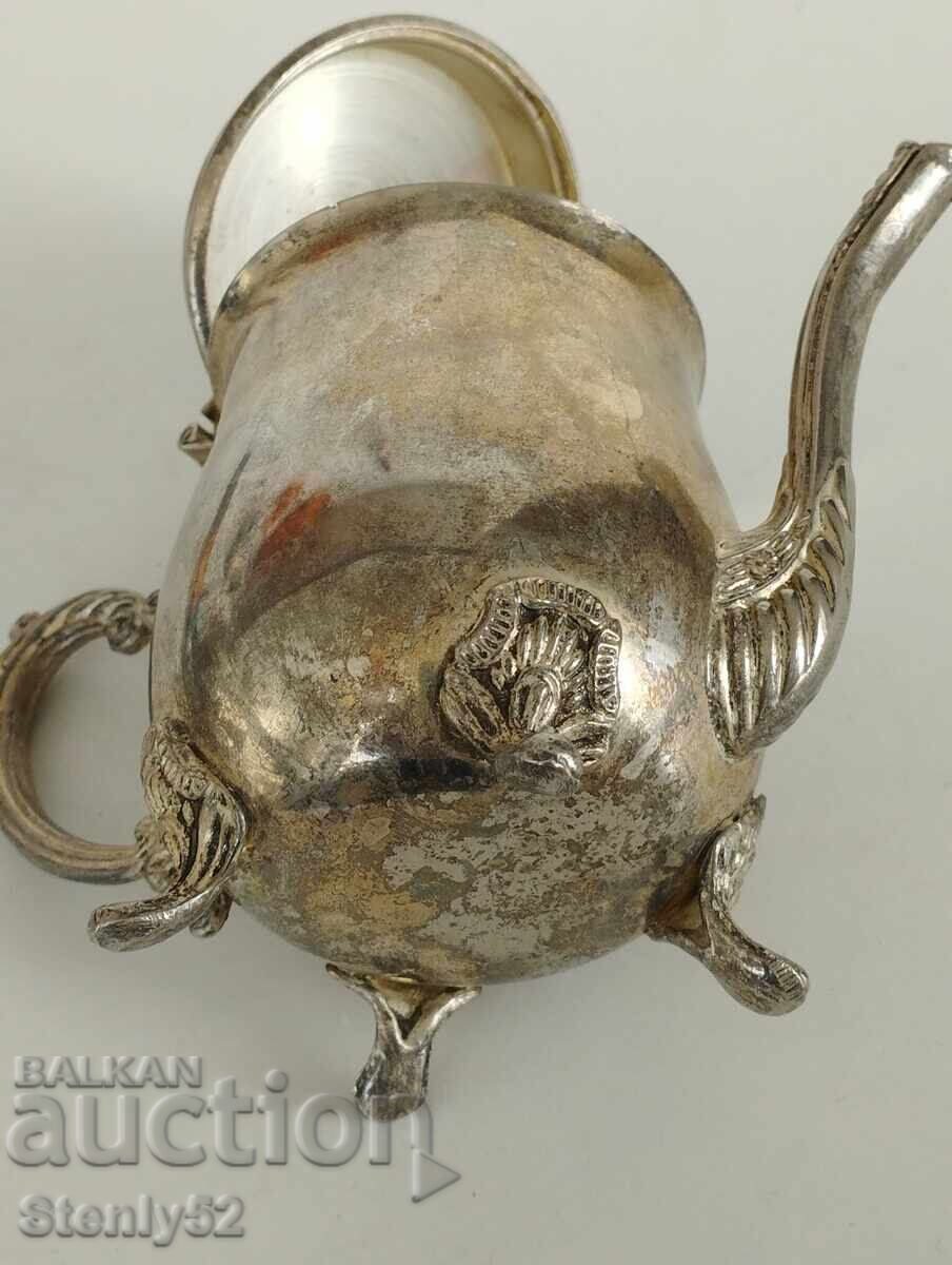 Auction  Old teapot for brewing tea, warm milk.