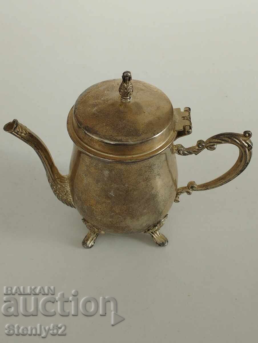 Old teapot for brewing tea, warm milk.