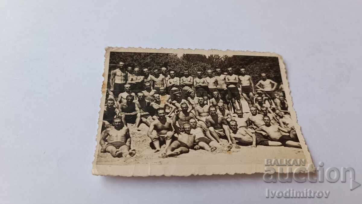 Photo Young men in retro swimsuits on the beach Photo Young men in retro swimsuits on the beach