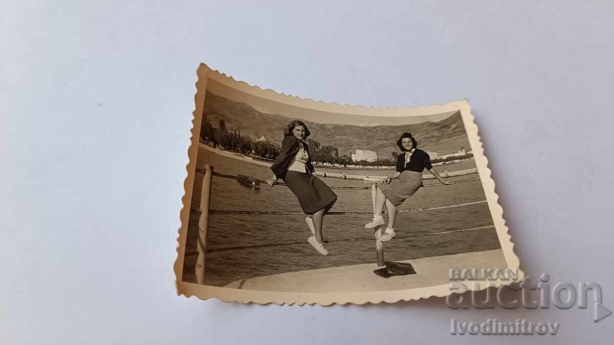 Photo Two young girls on the pier Photo Two young girls on the pier