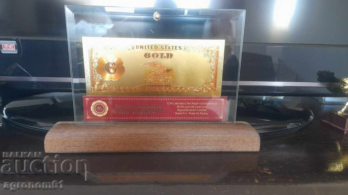 Delivery of Souvenir gold banknotes 100 dollars 1882 in a stand Delivery of Souvenir gold banknotes 100 dollars 1882 in a stand