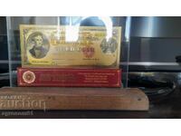 Souvenir gold banknotes 100 dollars 1882 in a stand