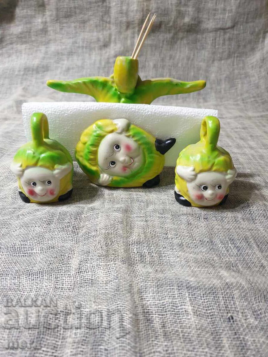 Auction  Porcelain salt and pepper shakers and napkin holder with a cheerful children's motif