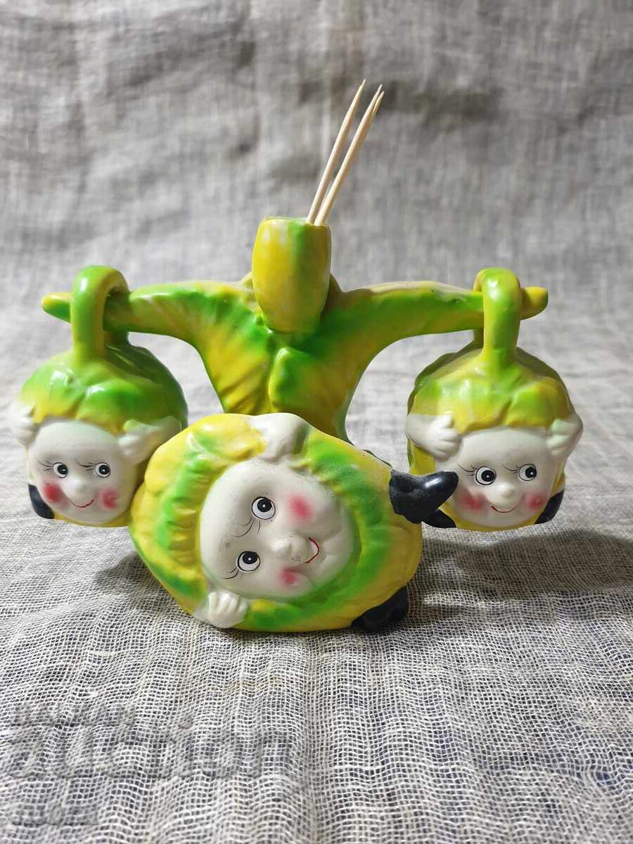 Porcelain salt and pepper shakers and napkin holder with a cheerful children's motif