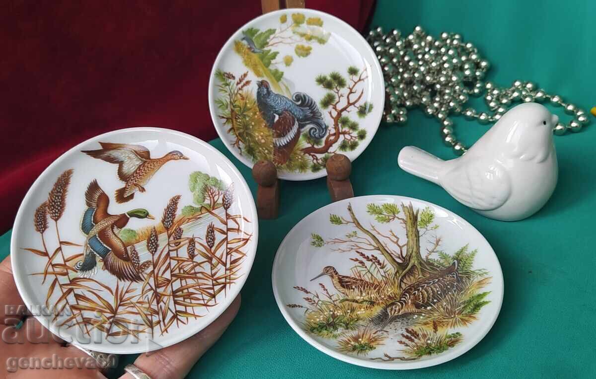 Collectible hand-painted porcelain plates KPM and sparrow