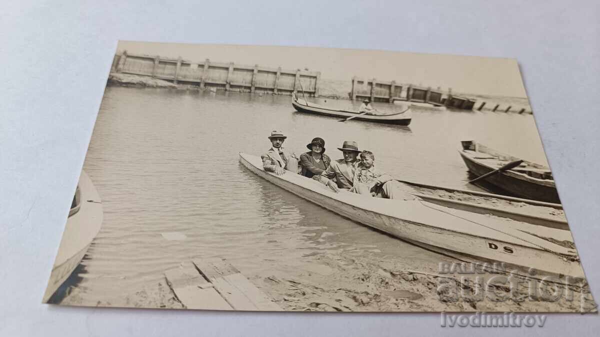 Ruse Photo Two men, a woman and a boy in a boat by the sand 1930 Ruse Photo Two men, a woman and a boy in a boat by the sand 1930
