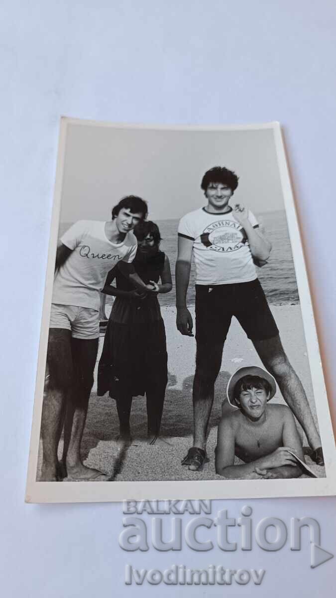 Photo of Three Young Men and a Young Woman on the Beach Photo of Three Young Men and a Young Woman on the Beach