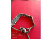 Brățară veche, Karma de autor