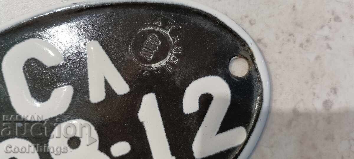 Delivery of Old enameled sign for a vintage motorcycle Delivery of Old enameled sign for a vintage motorcycle