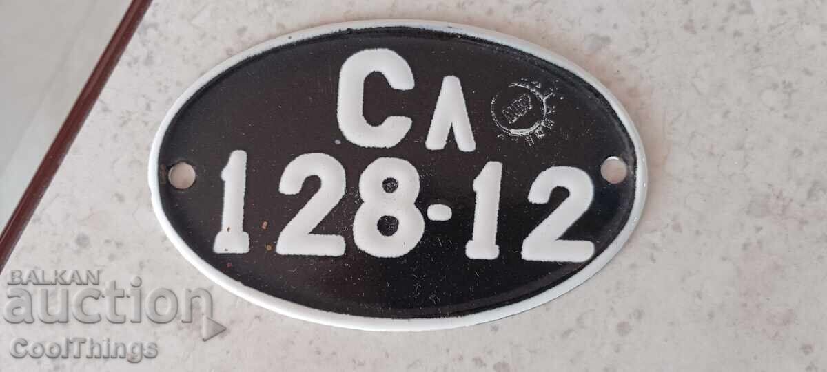 Old enameled sign for a vintage motorcycle Old enameled sign for a vintage motorcycle