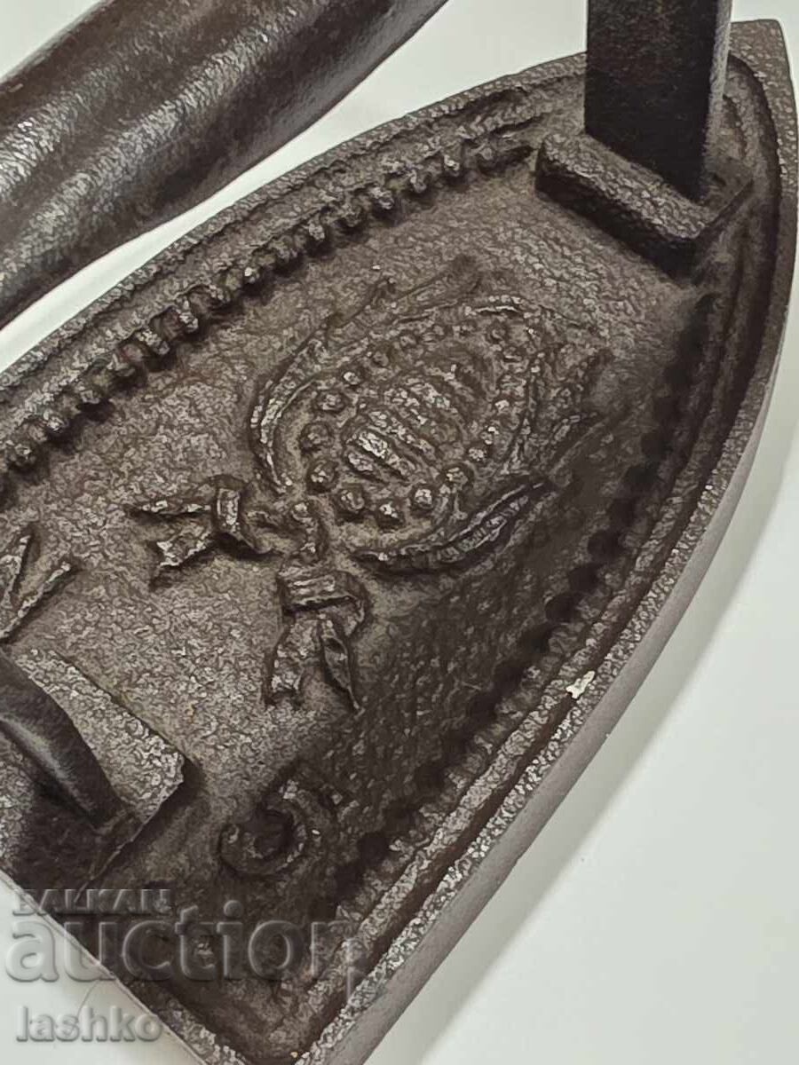 Auction  An old iron on fire