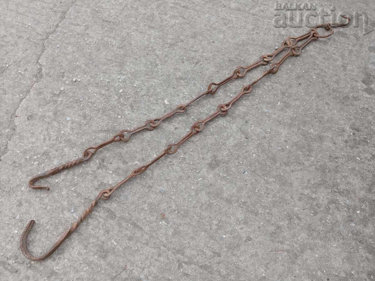 Old wrought iron chain with hook for a hearth, hooks for a fireplace