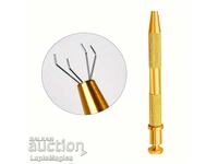 Instrument pentru prinderea precisă a pietrelor prețioase