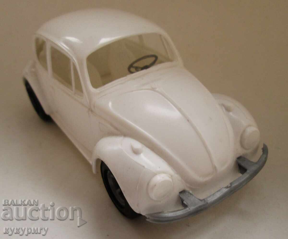 Delivery of Old plastic toy car VW Beetle Delivery of Old plastic toy car VW Beetle