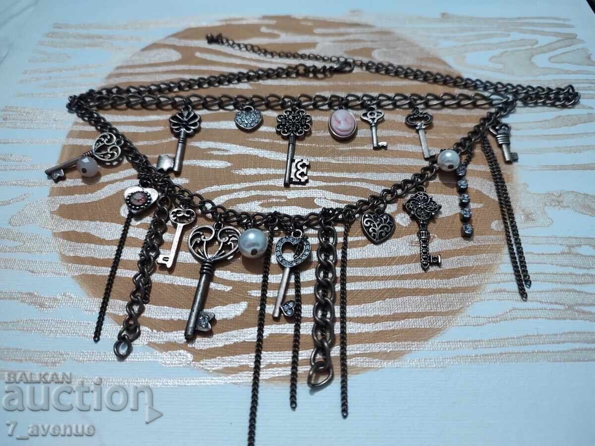 Necklace, stylish and charming with a gem/cameo, key, and more 30.03.2025 with price 99.00 BGN | € 50.62