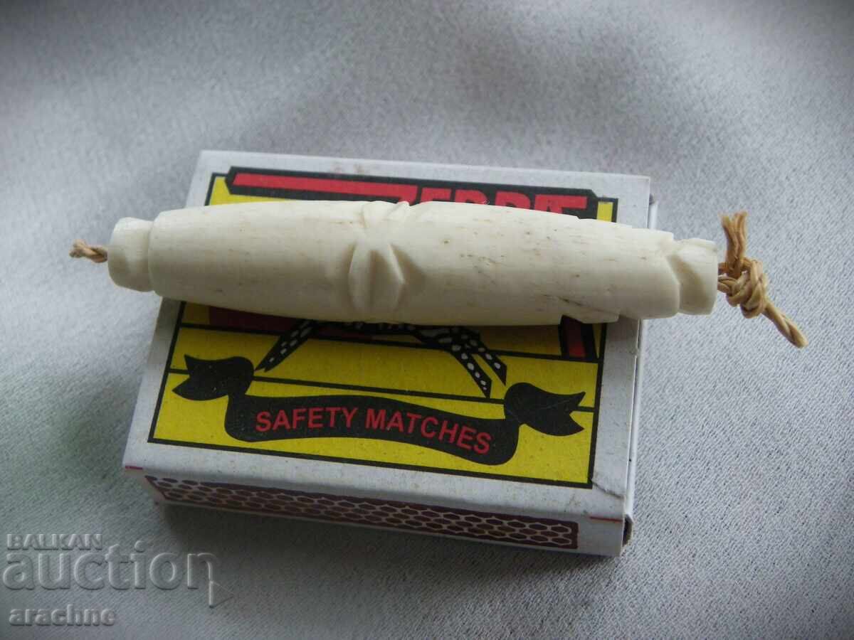 Auction Large pendant, carved from a hippopotamus tooth, Namibia Auction Large pendant, carved from a hippopotamus tooth, Namibia