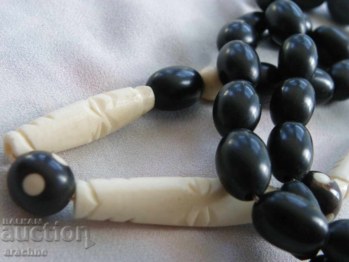 Auction  Necklace made of buffalo horn and hippopotamus tooth, Senegal