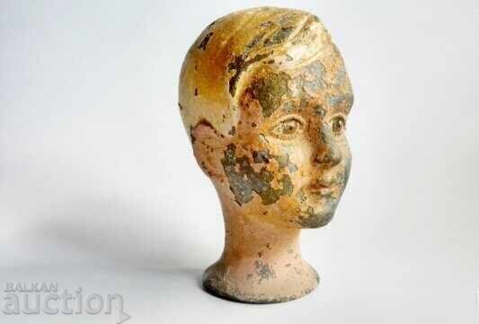 Metal head of a very old 19th century doll