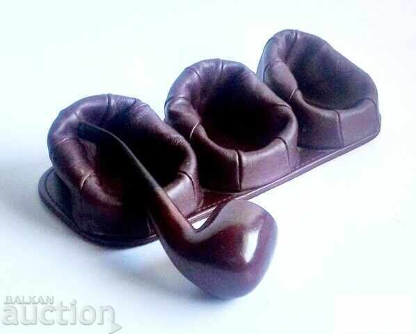 Old leather pipe stands