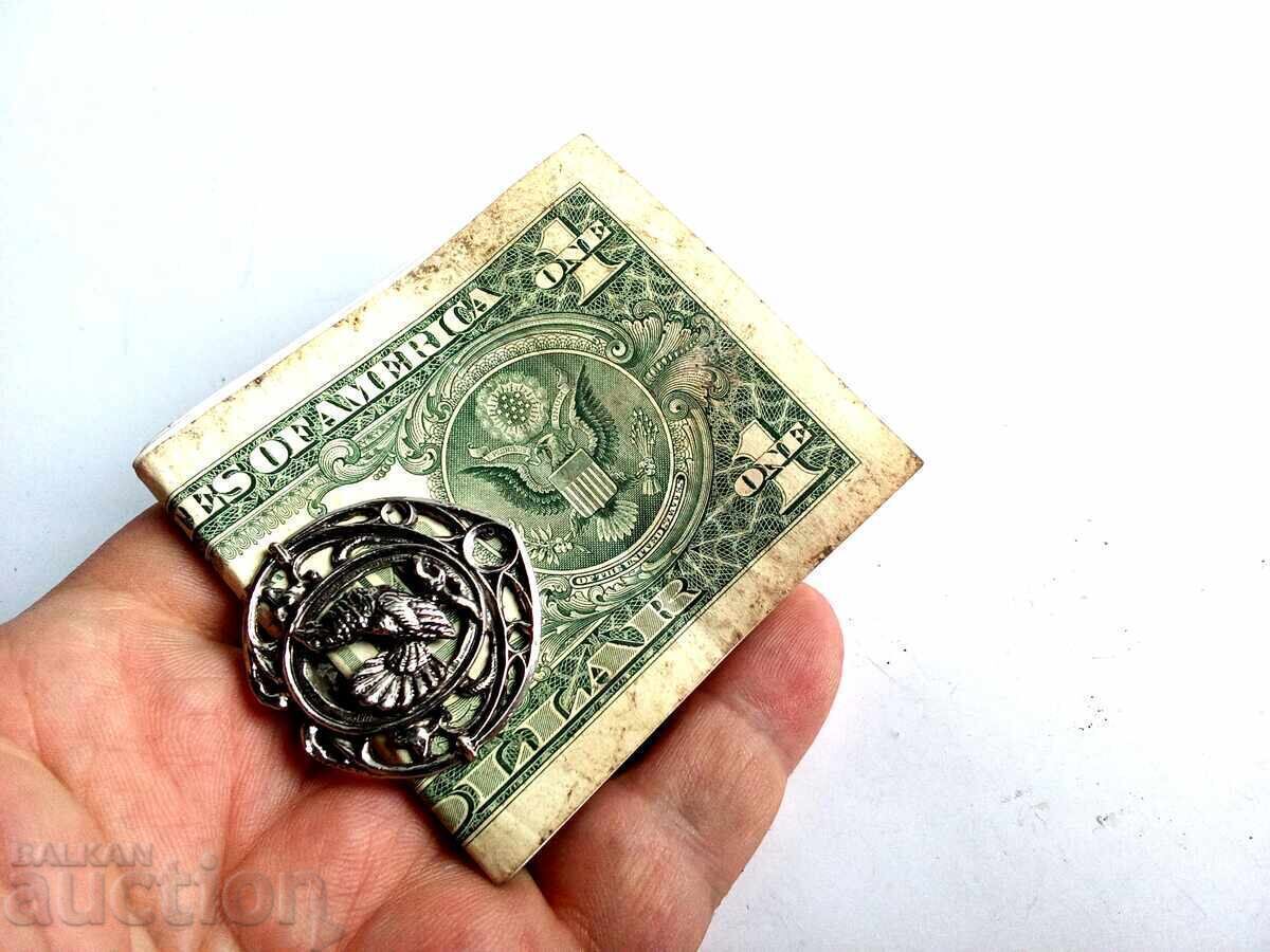 Old silver-plated money clip for banknotes