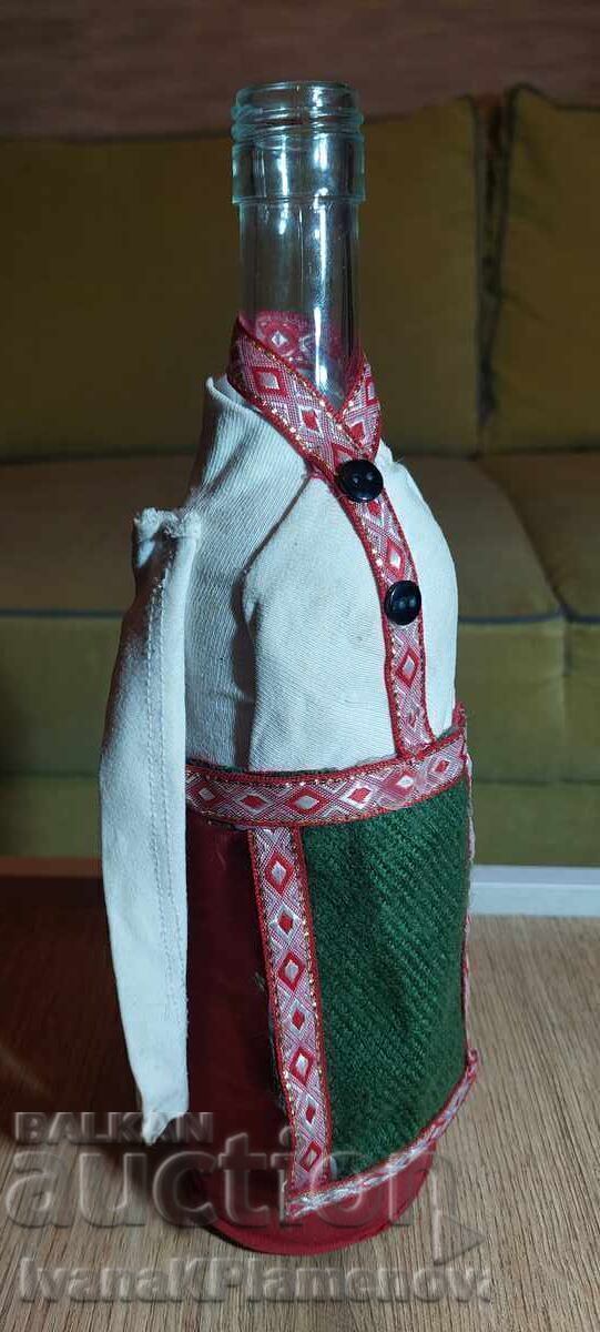 Auction  A bottle dressed in traditional costume for connoisseurs