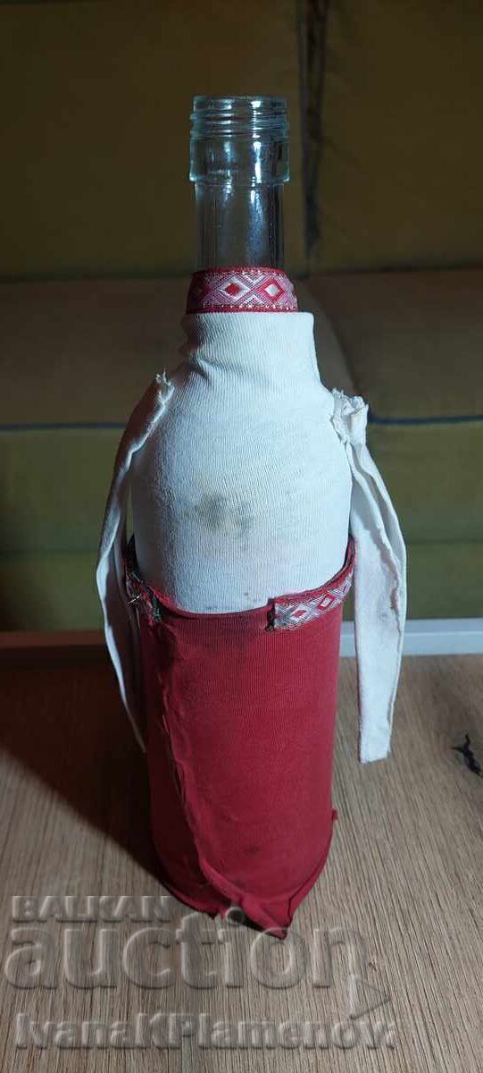 Delivery of A bottle dressed in traditional costume for connoisseurs