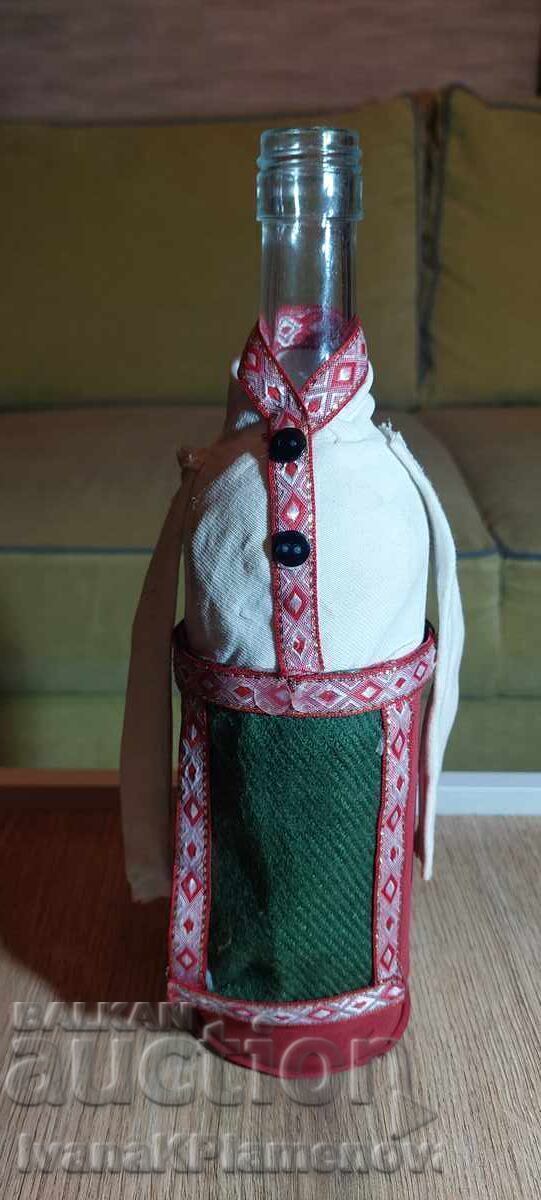 A bottle dressed in traditional costume for connoisseurs