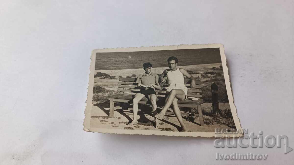 Photograph Golden Sands Two young men sitting on a bench 1953