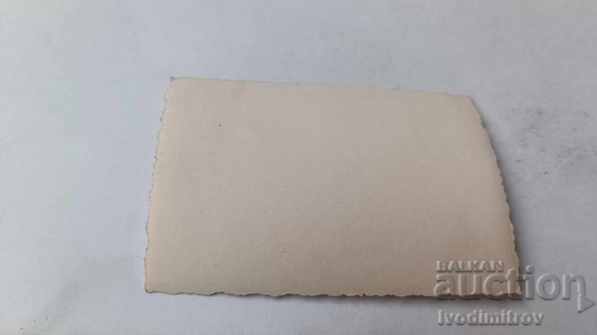 Photo: Three young men sitting on a rock with price 2.35 BGN | € 1.20