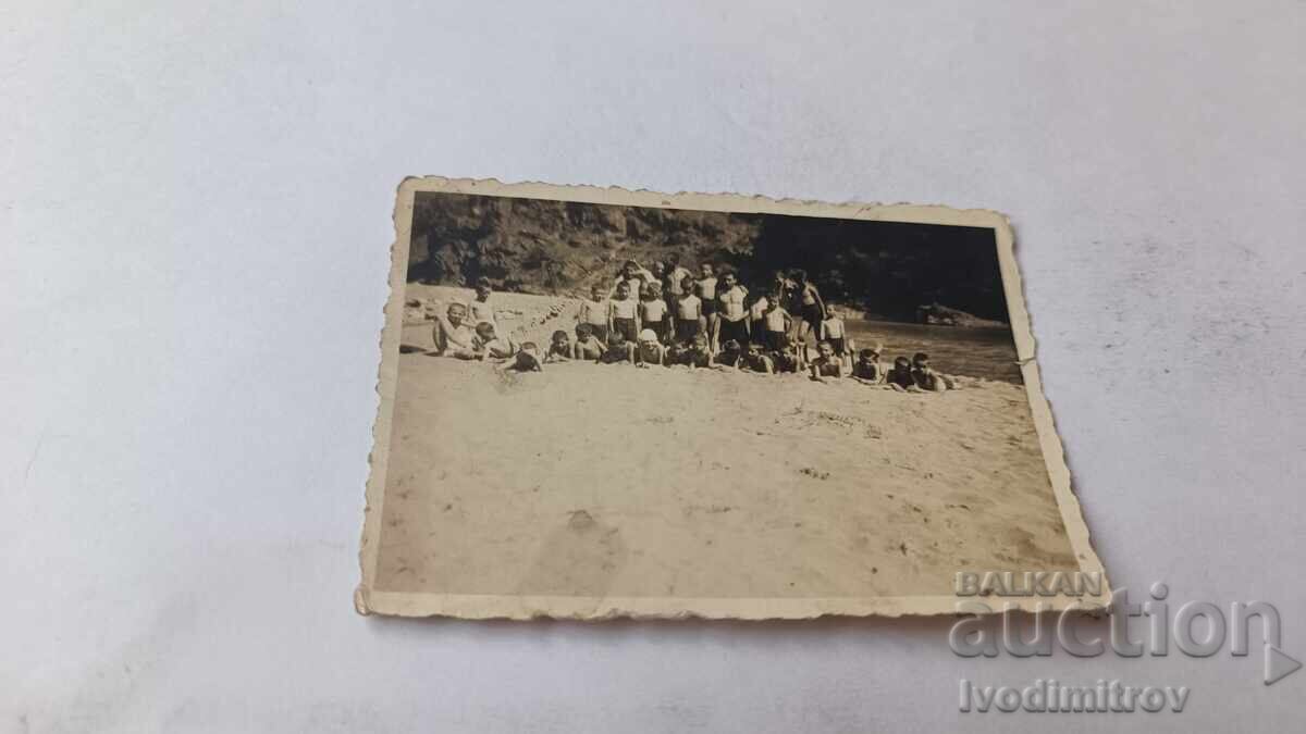 Photo of Boys and Young Men on the Beach Photo of Boys and Young Men on the Beach