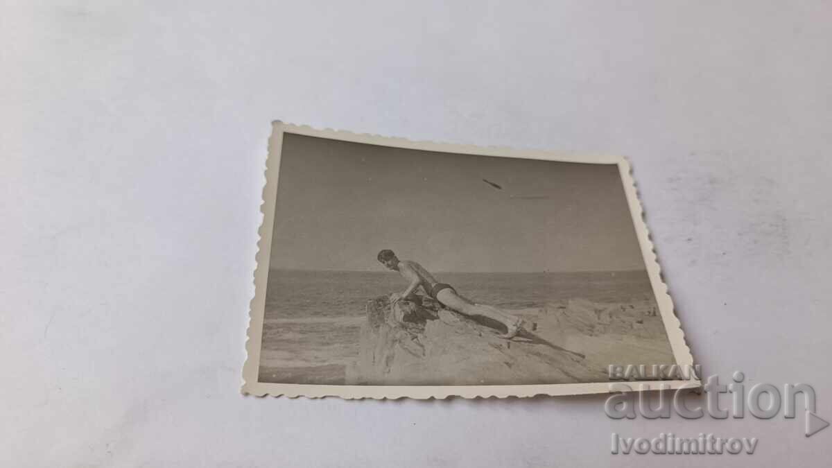 Photo Young man on a cliff above the sea 1964 Photo Young man on a cliff above the sea 1964
