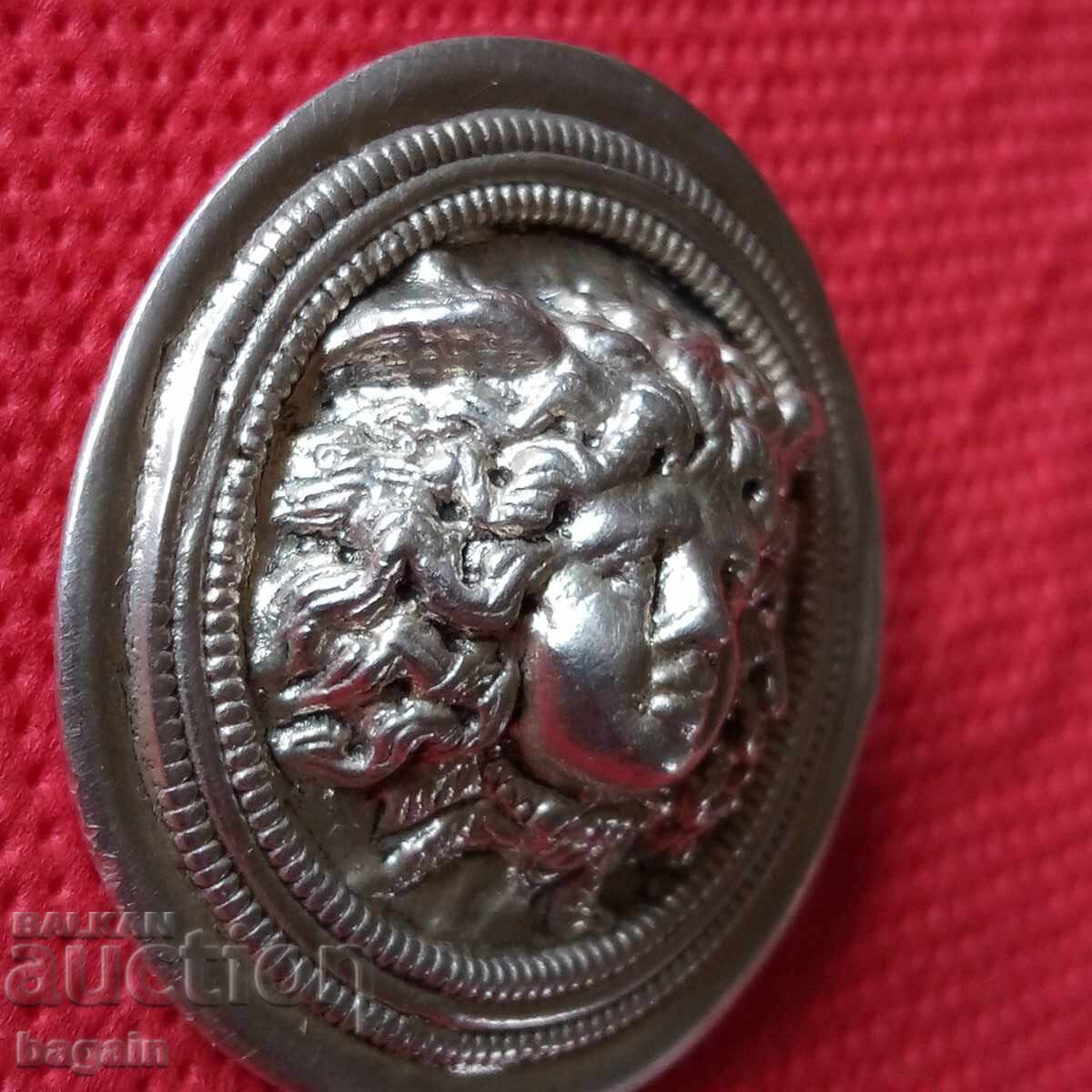 Δημοπρασία Ερμής, ασημένια καρφίτσα Δημοπρασία Ερμής, ασημένια καρφίτσα