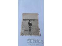 Fotografie Tânără pe plajă