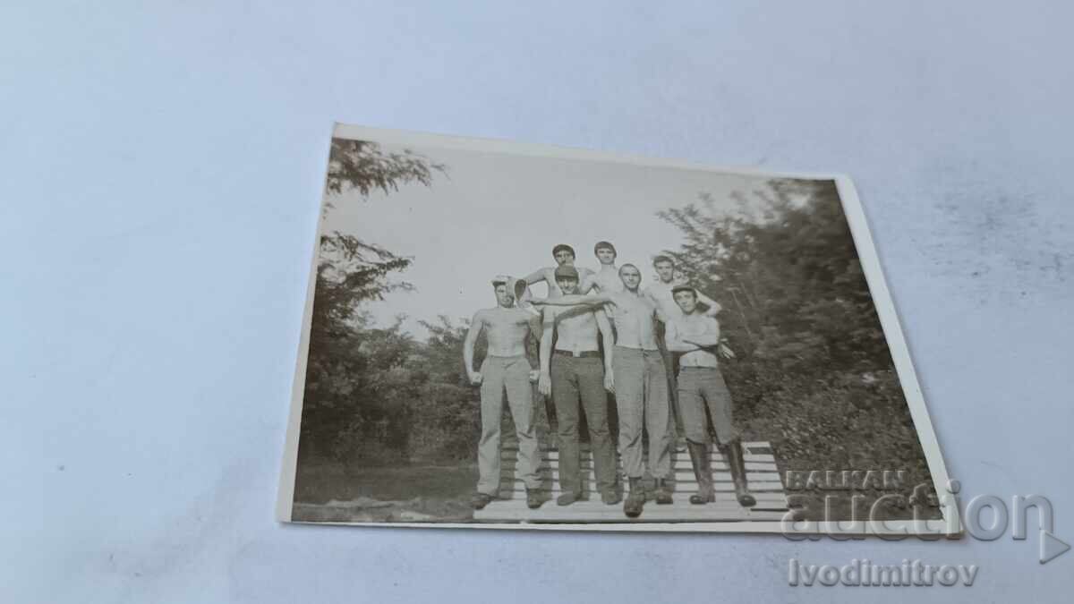 Photo of Soldiers, Bare-Chested on a Wooden Pier Photo of Soldiers, Bare-Chested on a Wooden Pier