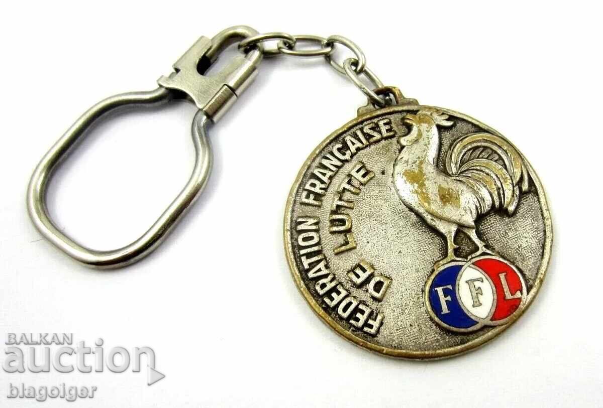 Френска  федерация по борба-Ретро Ключодържател-Петли