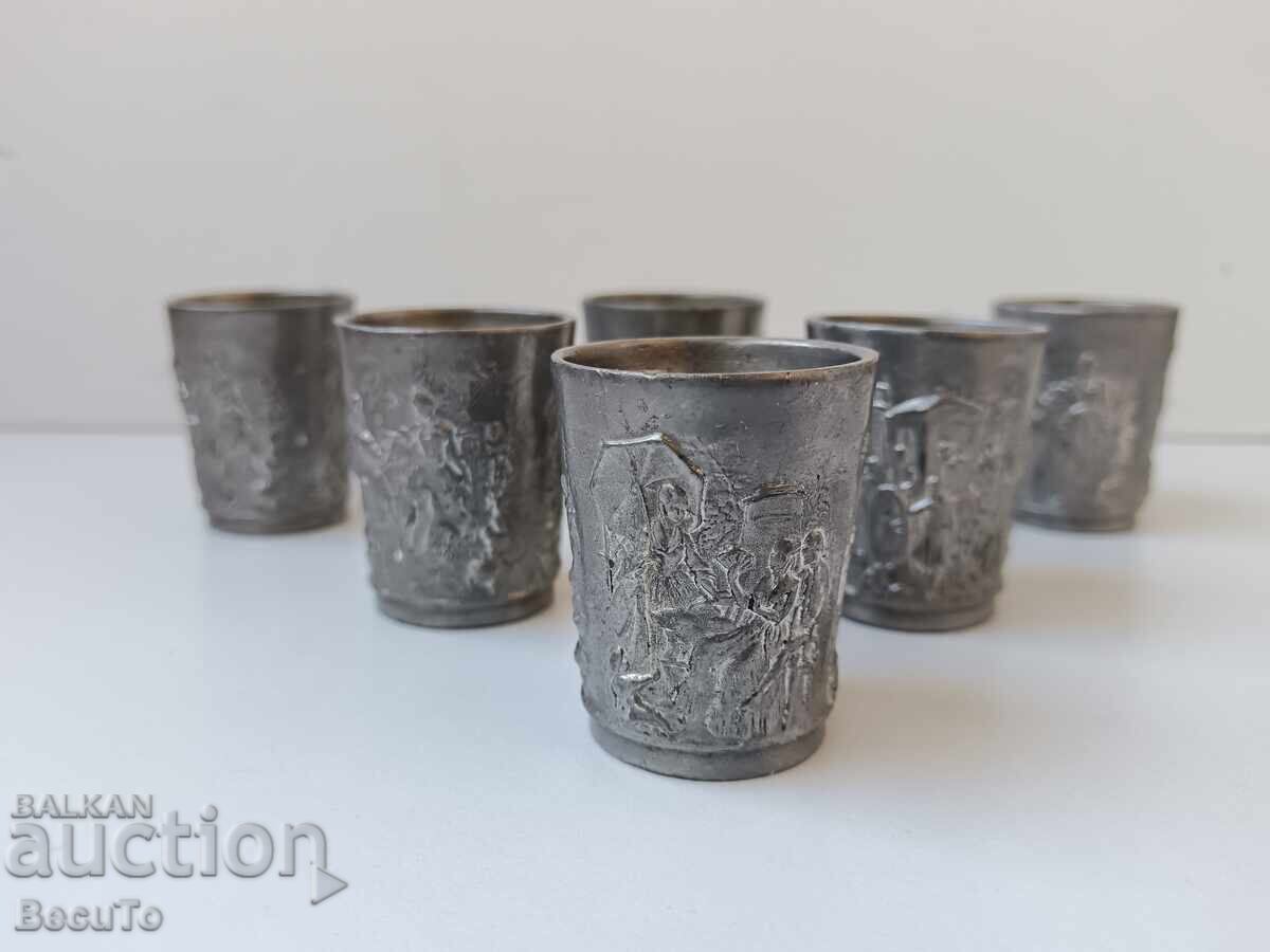 Auction  6 tin cups, stamped with domestic scenes, they are sturdy