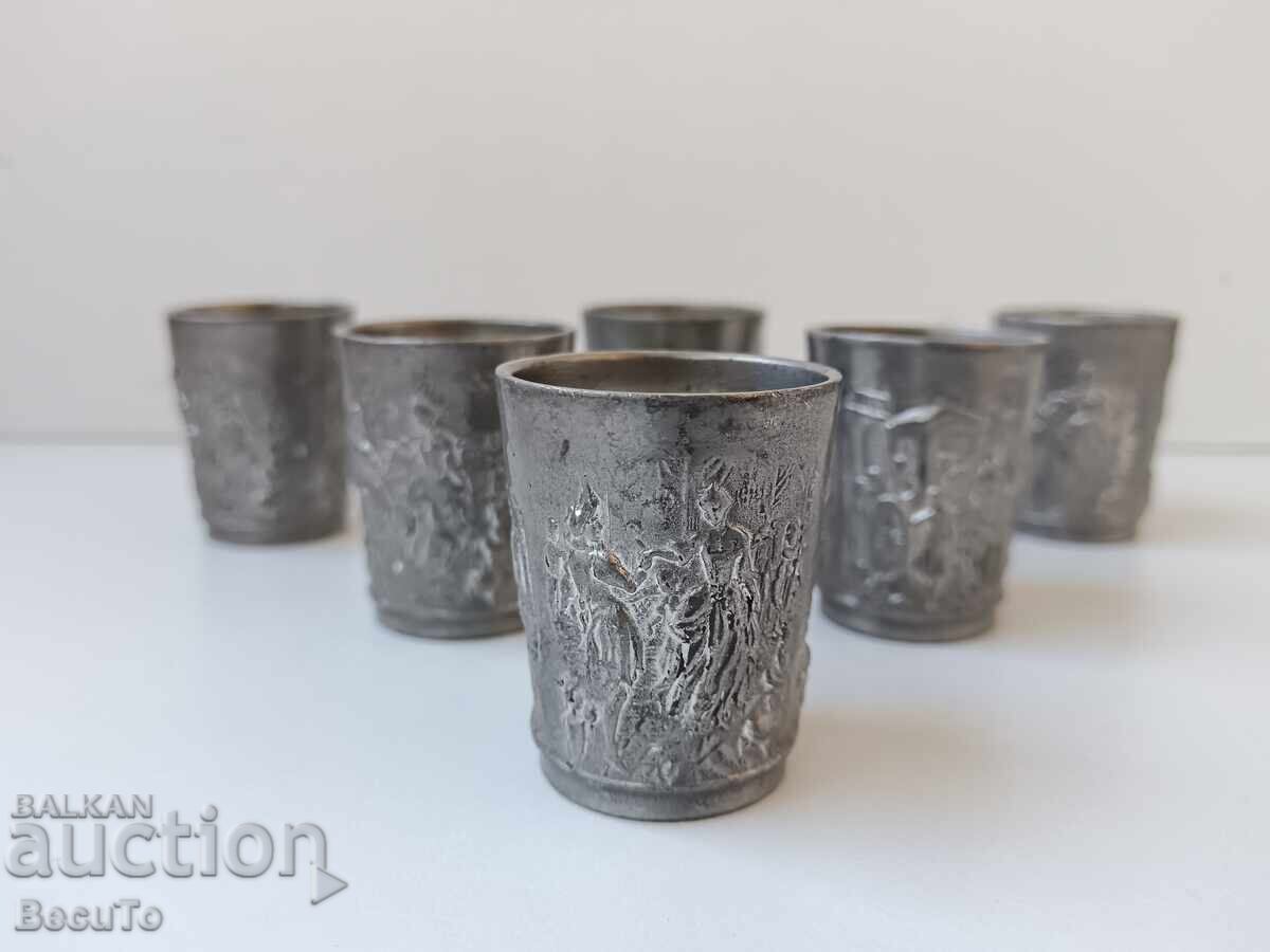 6 tin cups, stamped with domestic scenes, they are sturdy