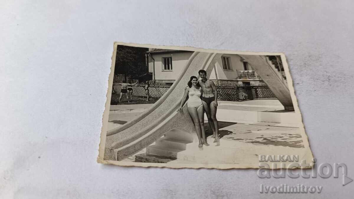 Photo of a Young Man and a Young Woman by a Water Slide Photo of a Young Man and a Young Woman by a Water Slide